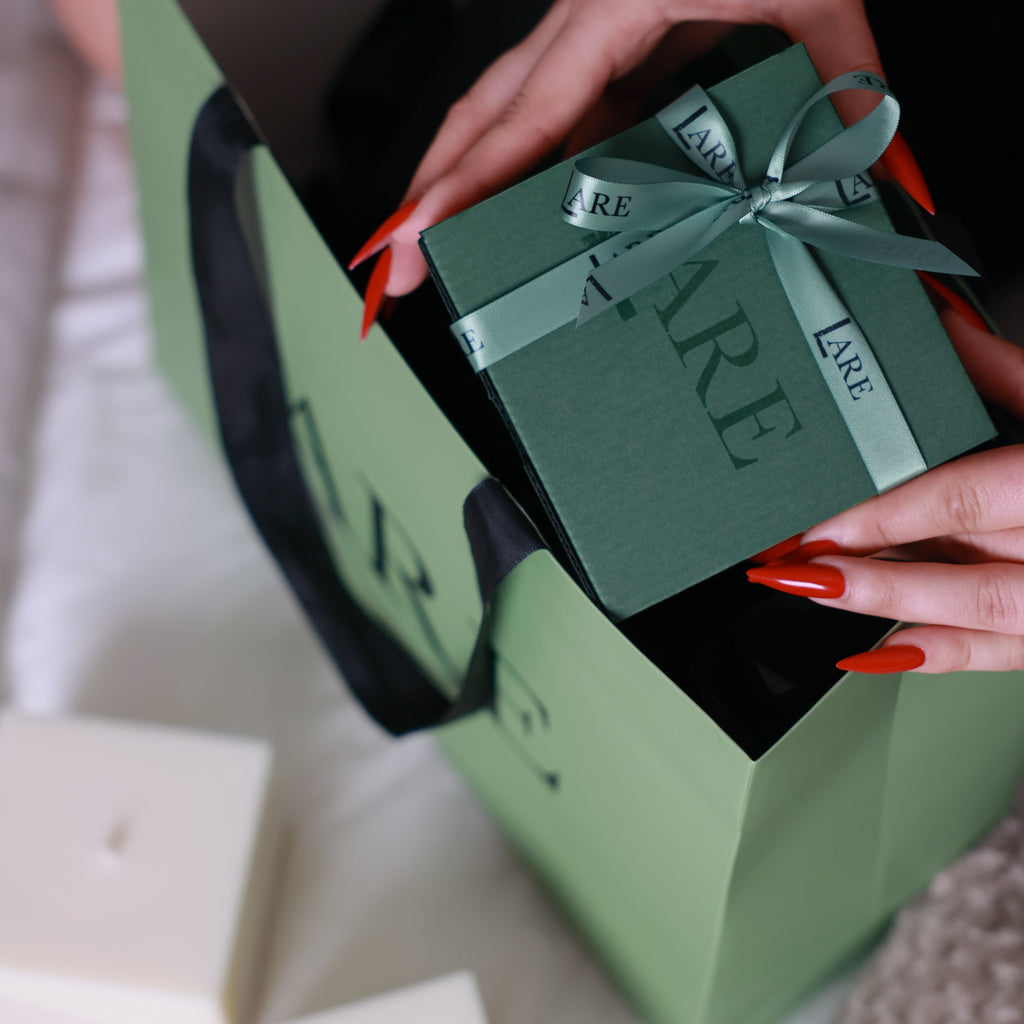 LARE gifts for work colleagues — sage green gift box with branded ribbon and sculptural soy wax candles, elegant corporate gift