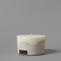 Highly scented oval beige cement soy candle, coated with nano