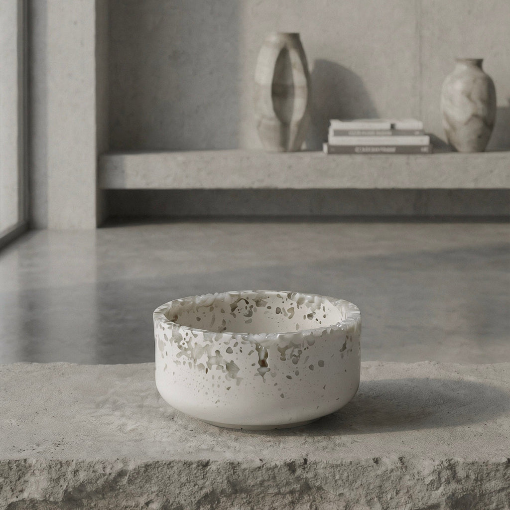 Mineral resin bowl on a concrete surface with a minimalistic background