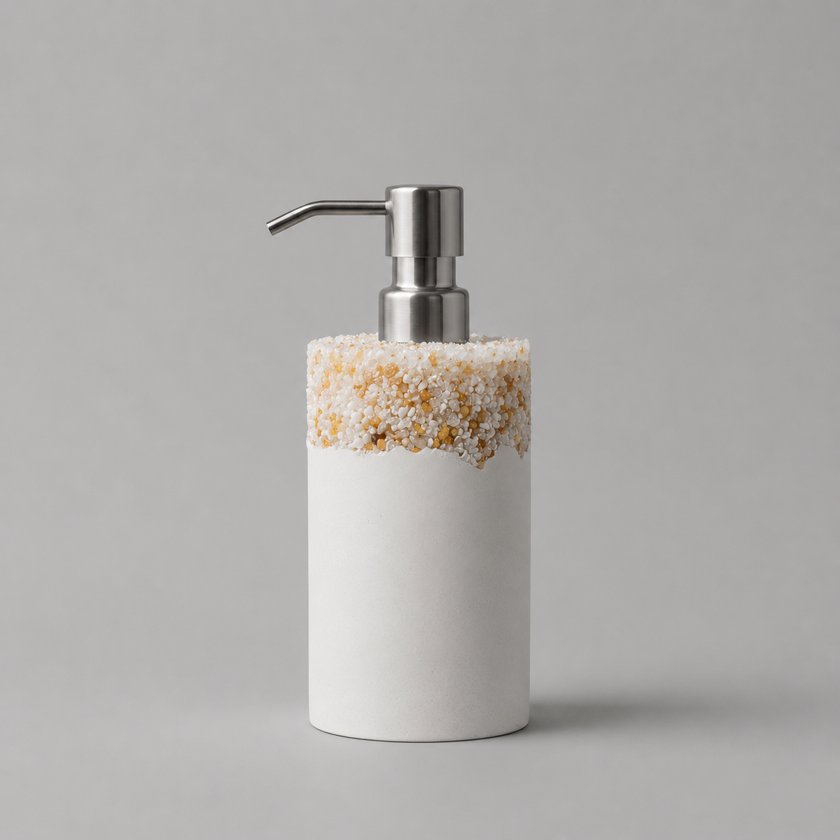 White soap dispenser with decorative top on a gray background