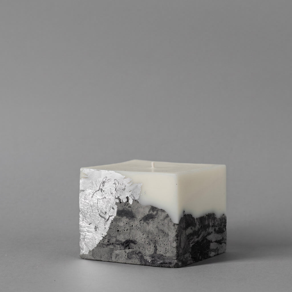 LARE essential oil candle — sculptural soy wax, raw concrete base in black, grey & silver for modern interiors