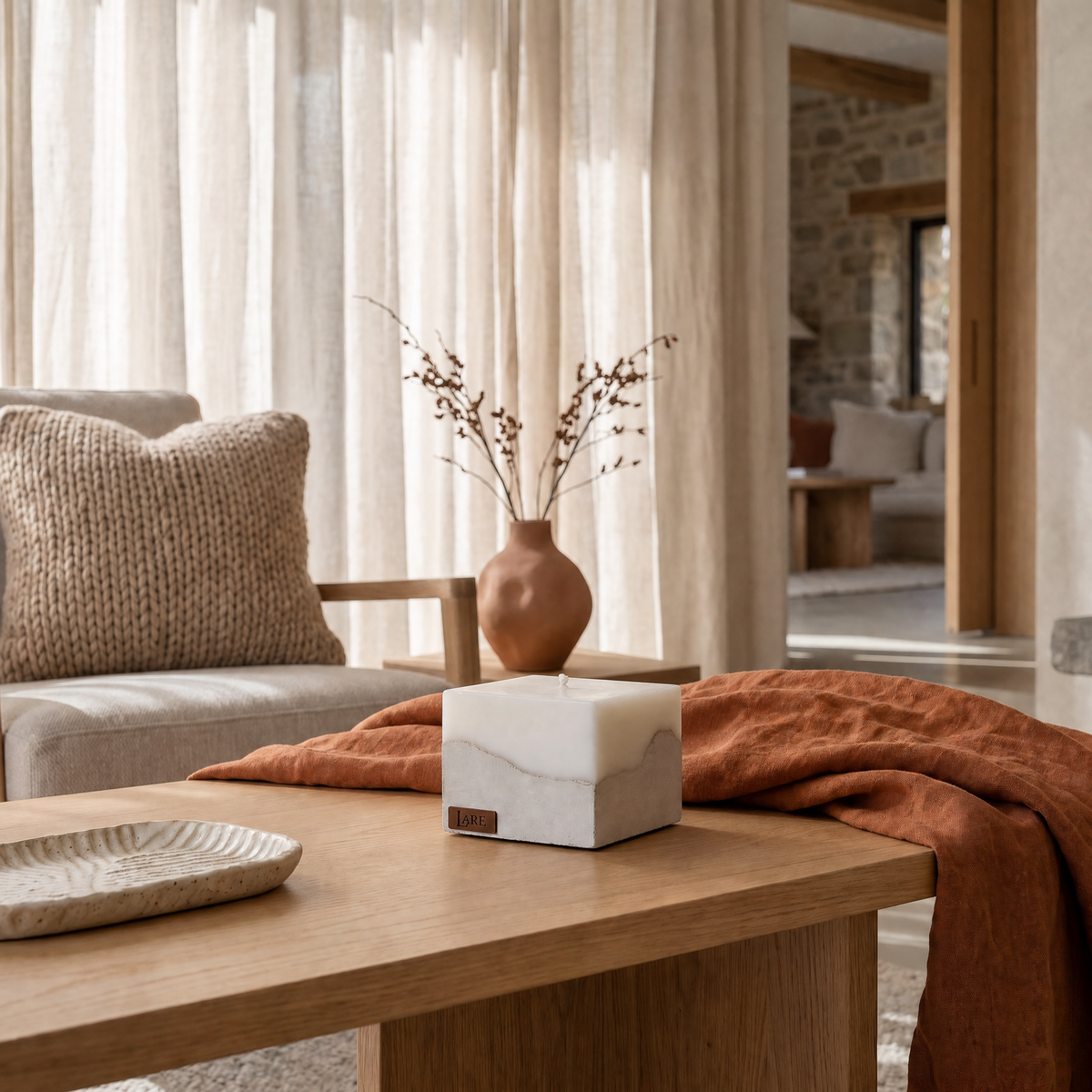 Sculptural beige candle by LARE Studio, featured among premium fall scented candles with warm fragrance notes of cinnamon, orange cedar wood.