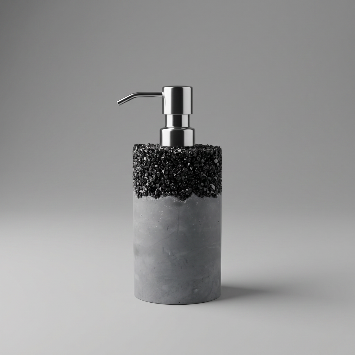 Jesmonite soap dispenser with black speckles and silver pump