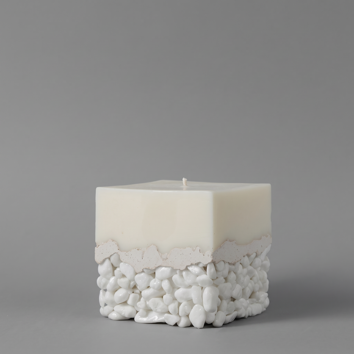 White luxury candle by LARE — designer soy candle wax with scented candle fragrances, oils and scents. Shown on a neutral gray background.